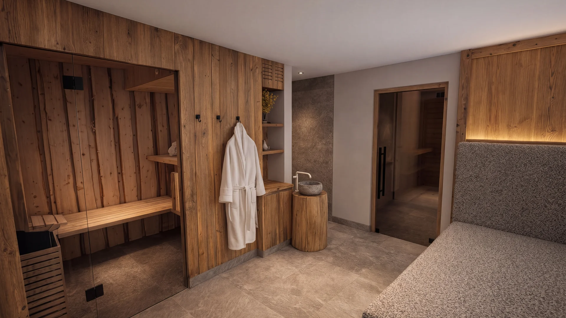 Wellnessraum mit holzverkleideter Sauna, Bademantel und Waschbecken